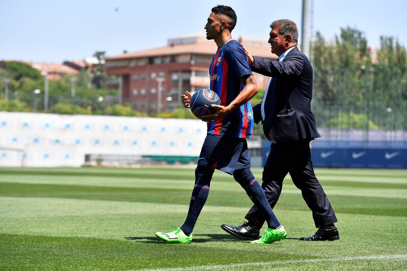 Barcelona's new Brazilian forward Raphinha with club president Joan Laporta for the presentation ceremony. Photograph: Getty Images 