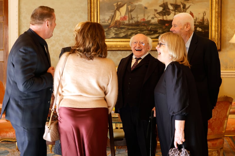 President Higgins and his wife Sabina greet guests arriving for the final afternoon tea party at Áras an Uachtaráin. Photograph: Alan Betson 