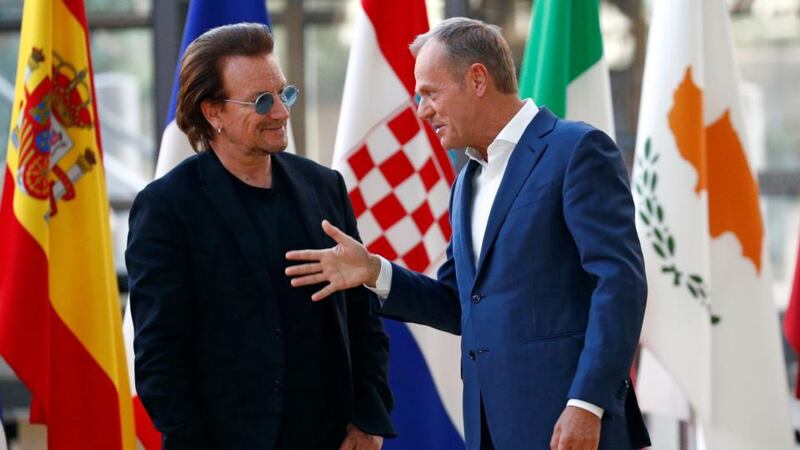 U2 in Europe: Bono with the European Council’s president, Donald Tusk, in Brussels. Photograph: François Lenoir/Reuters