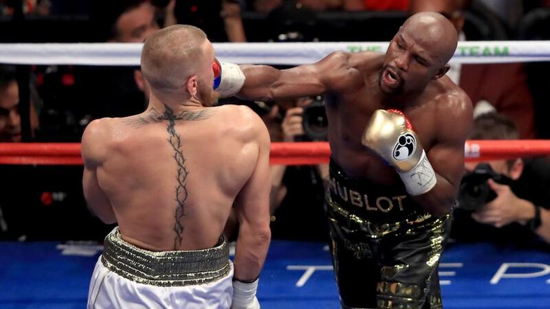 Floyd Mayweather Jr catches Conor McGregor during their lucrative Las Vegas bout. Photograph: Sean M. Haffey/Getty