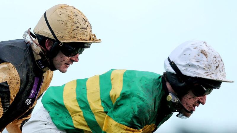 Ruby Walsh and Tony McCoy cross the line in the first race of the day. Photograph: James Crombie/Inpho