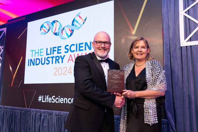 Rory Kelly, senior validation engineer at Ellab, presents the women in life sciences award to Dr Dara Meldrum, Vertigenius