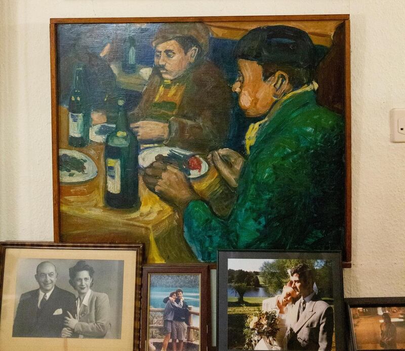 One of Roden’s paintings, and, at bottom left, a photo of her parents, Nelly and Cesar Douek. Photograph: Lauren Fleishman/New York Times