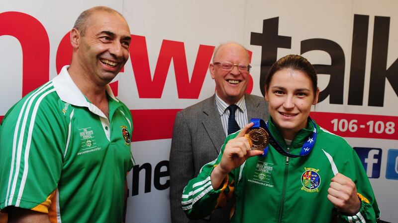 A 2012 file photograph of boxer Katie Taylor pictured with her father, Pete, after the fighter arrived home from China with her fourth AIBI world lightweight title. Photograph: Aidan Crawley