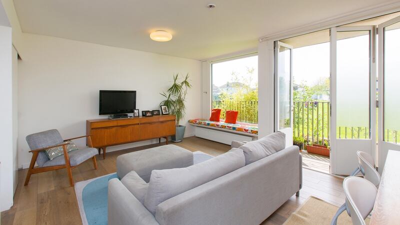 The living-dining-kitchen area, which occupies the upstairs of the house, has large windows offering great views