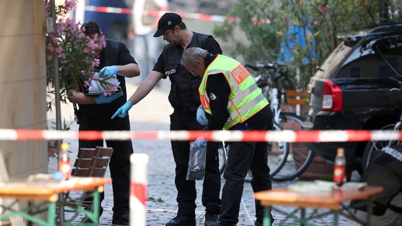 Police investigators work at the site of a suicide bombing.  Photograph: AFP