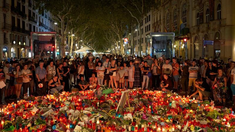 Mourners gather at Las Ramblas,  in Barcelona, Spain. Photograph: Samuel Aranda/The New York Times