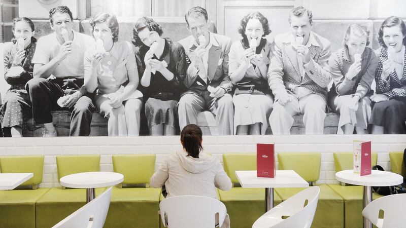 A woman eats in Gino’s Gelato in South Great Georges Street, Dublin. Photograph: Aidan Crawley