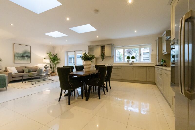 Spanning the width of the house at the back is a bright, airy kitchen/dining/livingroom, with three roof lights and large double doors leading out to the back garden.