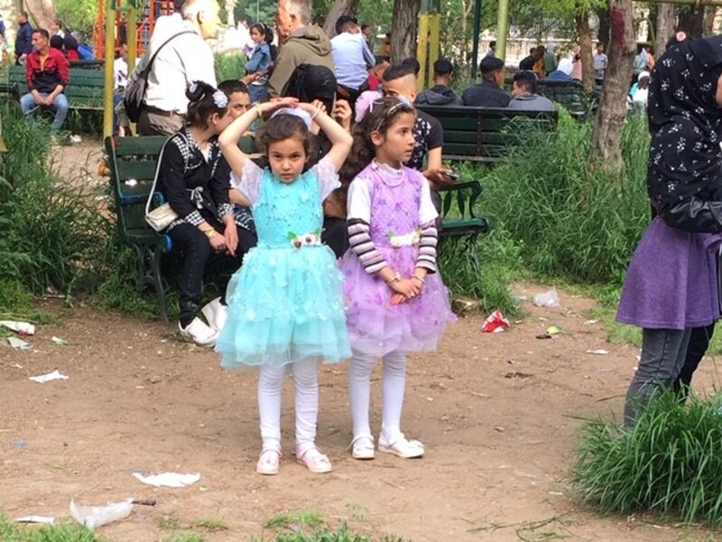 Children in Aleppo during the Eid festival, which marks the end of the Muslim month of Ramadan