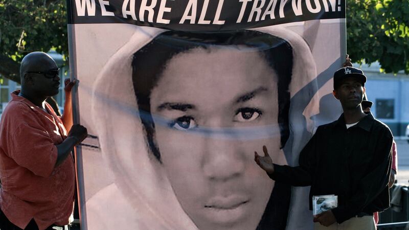 Men hold a sign during a demonstration supporting Trayvon Martin in Los Angeles, California in 2013. File photograph: Jonathan Alcorn/Reuters