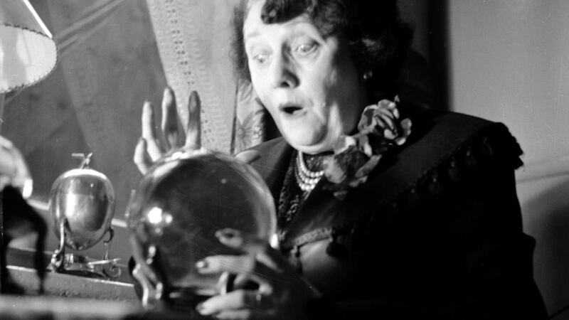 Madame Ve-ara, a palmist, in her first floor studio in Wardour Street in Piccadilly, London. 1953