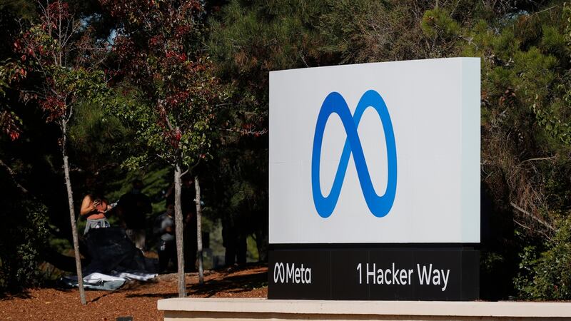 A sign with the logo and the name Meta is displayed in front of Facebook headquarters. Photograph: Justin Sullivan/Getty Images