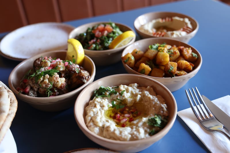 The vegan mezze: hummus, tabbouleh, baba ghanoush, batata hara and cauliflower fritters