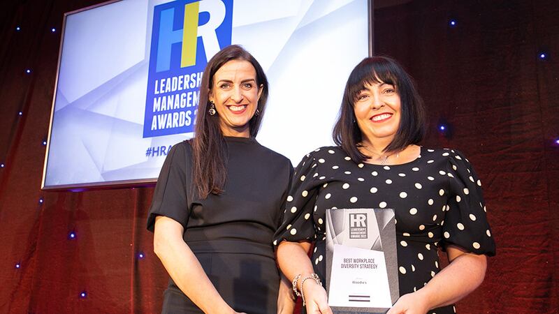 Suzanne Feeney, country manager, Robert Walters, presents the Best Workplace Diversity Strategy award to Sharon Kelly, Woodie's.