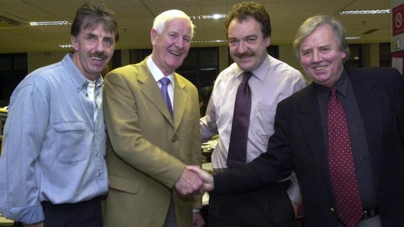 Peter Byrne, second left, is congratulated on his retirement from The Irish Times sports department by Pat O’Hara, executive editor, far right, with  Mark Lawrenson, former soccer international and Malachy Logan, sports editor. Photograph: Moya Nolan