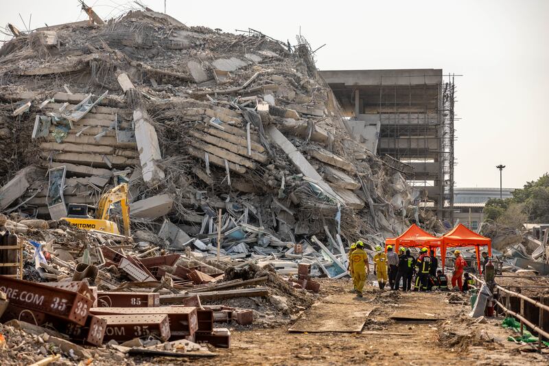 Myanmar and Thailand earthquake: Thai rescue workers arrive on scene at a construction building collapse in the Chatuchak. Photograph: Lauren Decicca/Getty Images 