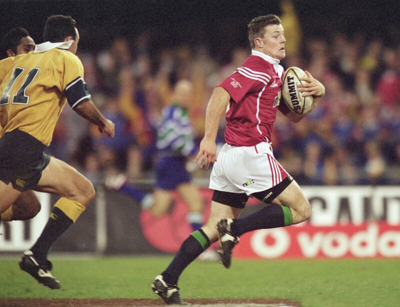 Brian O'Driscoll gets away from Joe Roff to score a try during the first Test against the Wallabies during the 2001 Lions tour. Photograph: Dave Rogers/Allsport
