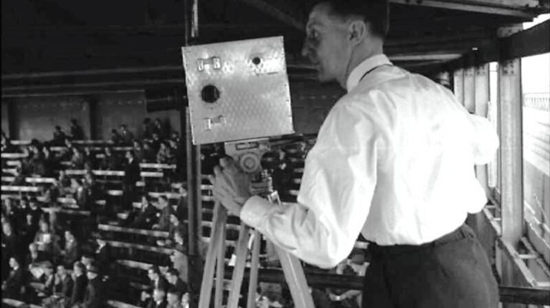 A camera operator at the 1957 All-Ireland hurling final. Photograph: IFI