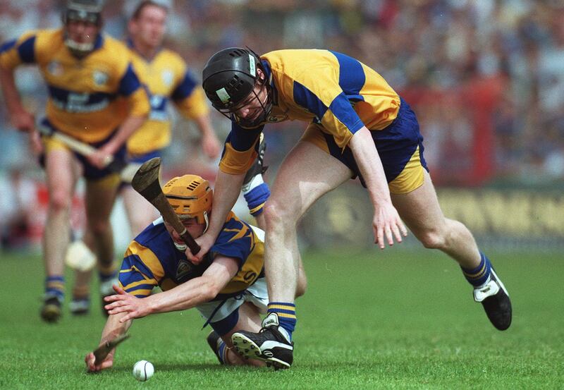 Clare's Frank Lohan (right) and Liam Cahill of Tipperary battle for possession during the 1997 Munster SHC final. Photograph: Patrick Bolger/Inpho