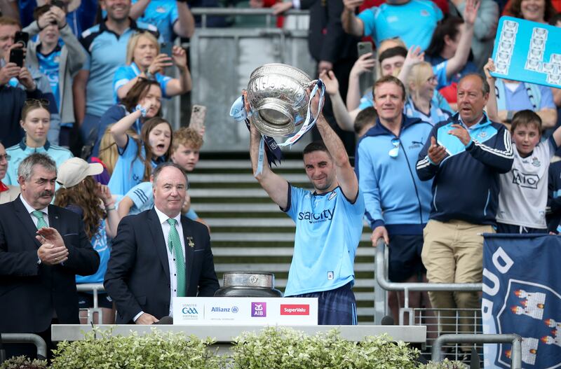 James McCarthy lifts the Delaney Cup after Dublin's victory over Louth in the 2024 Leinster Senior Football final at Croke Park. Photograph: Tom Maher/Inpho