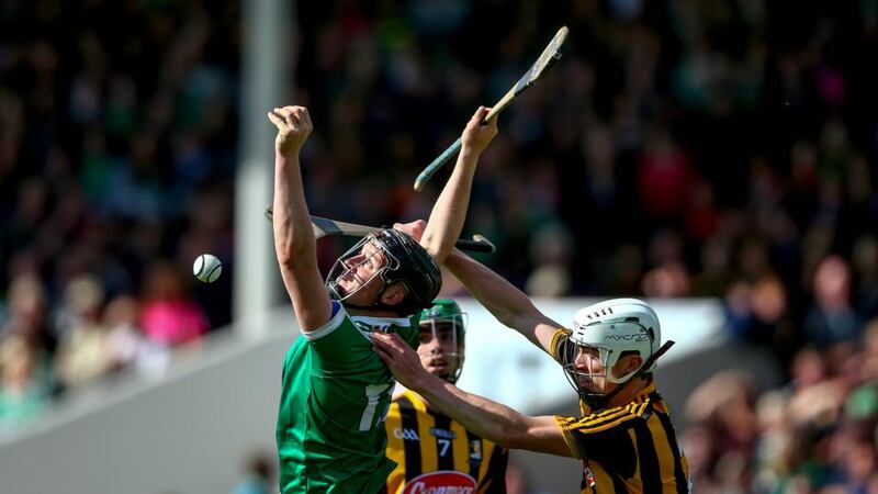 Kilkenny’s Michael Cody and Peter Casey of Limerick battle for possession. Photograph: Cathal Noonan/Inpho