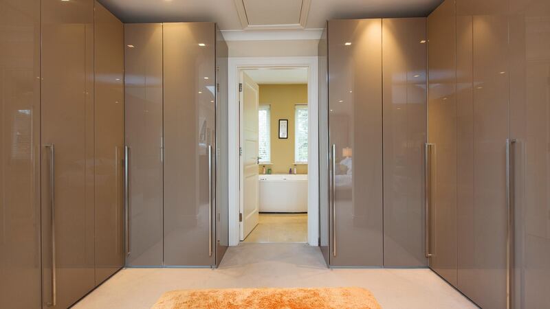 The main bedroom has it all: a dressingroom area, a mostly-tiled en suite with a Jacuzzi bath and a shower and double doors onto the outdoor terrace