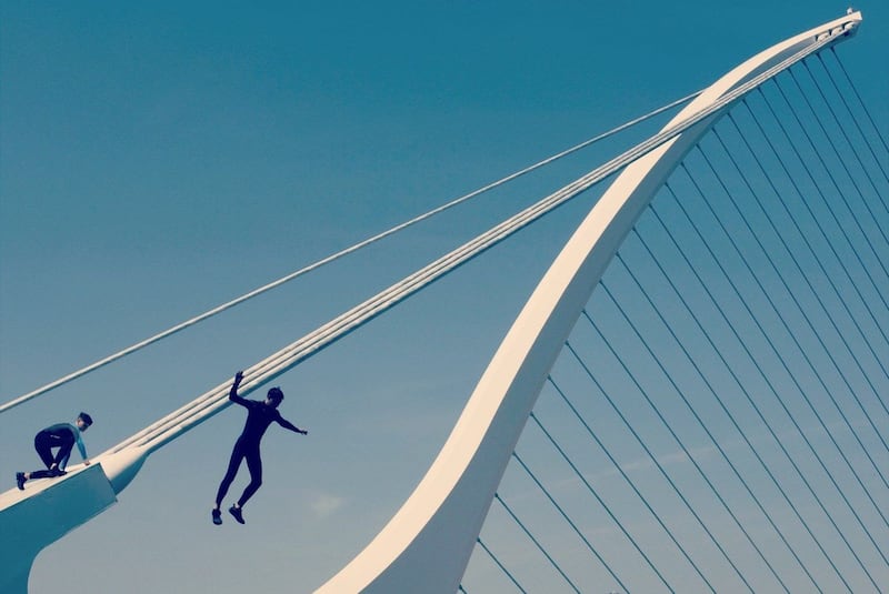 Kids jumping from the Samuel Beckett bridge, Dublin. Photograph: Elise Fisher