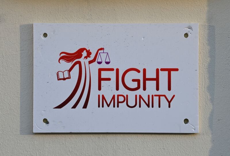 A plaque in Brussels displays the logo of Fight Impunity, an association founded by Pier Antonio Panzeri to promote accountability for violations of human rights. Photograph: John Thys/AFP via Getty Images