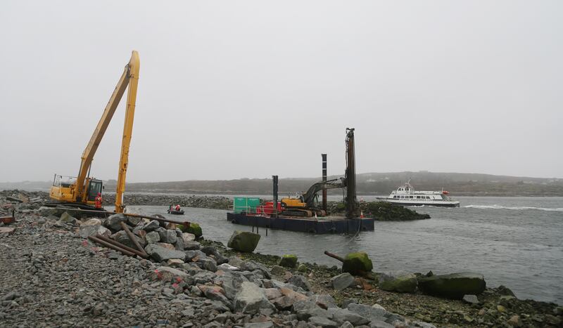 An Aran Island ferry passes by as work takes place on the new deep water quay as part of the expansion of Rossaveal harbour in Connemara, Co. Galway. Photo: Bryan O’Brien / The Irish Times

