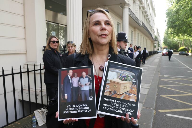 Lorelei King, whose husband died during the pandemic protests as former UK health secretary Matt Hancock arrives to give evidence to the Covid-19 Inquiry at Dorland House in London. Photograph: Jonathan Brady/PA Wire