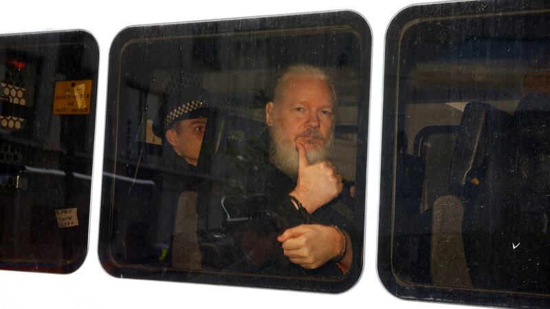 WikiLeaks founder Julian Assange  in a police van after he was arrested    outside the Ecuadorian embassy in London. Photograph: Henry Nicholls/Reuters