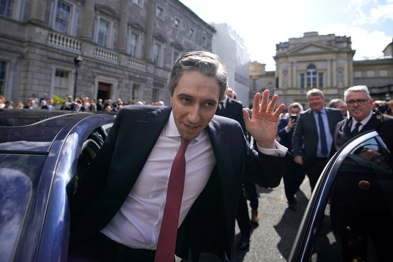 Harris steps in to a car before leaving the Dáil and heading to Áras an Uachtaráin. Photograph: Niall Carson/PA Wire 