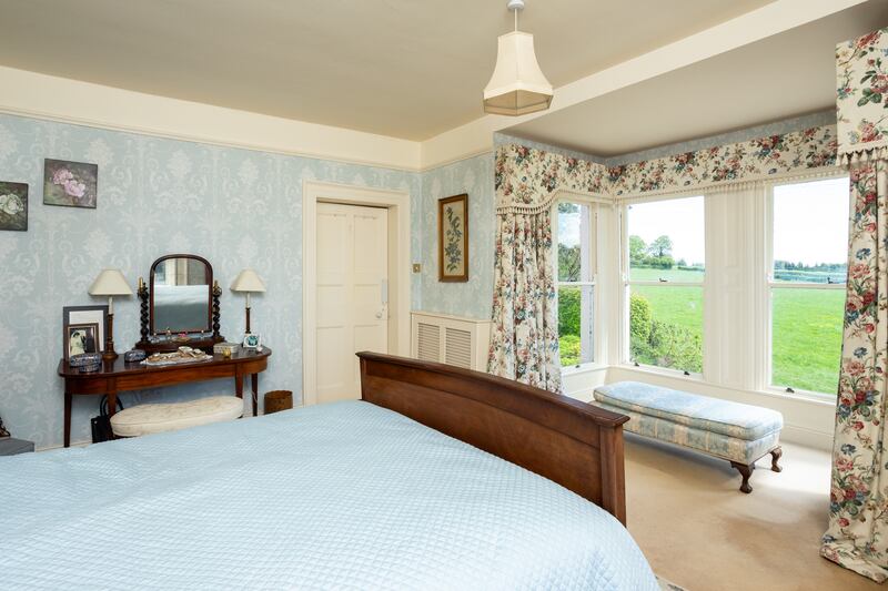 Two of the four bedrooms lie to the front and have box bay windows