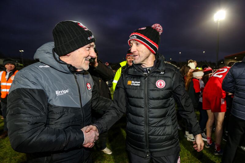 Derry manager Mickey Harte shakes hands with Tyrone joint manager Brian Dooher after the game. Photograph: Lorcan Doherty/Inpho
         