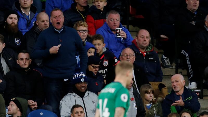 A fan points to his chest as he shouts at West Bromwich Albion’s James McClean, who is wearing a shirt without a poppy. Photograph: Reuters