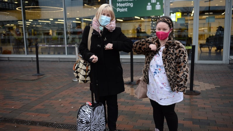 Hazel McMullen (left) from Coleraine meeting her daughter, Chaney Bonnough, flying in from Canada to Dublin Airport for Christmas. Photograph: Dara Mac Dónaill / The Irish Times