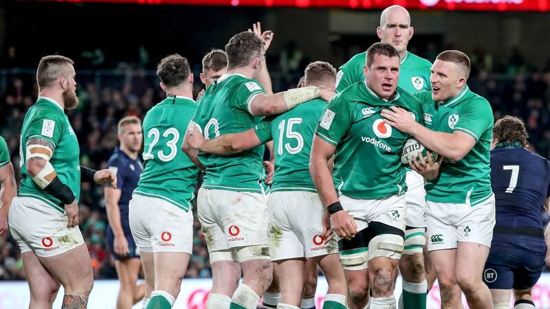 Ireland’s CJ Stander is congratulated by  Andrew Conway after winning a late turnover against Scotland. Photograph: Dan Sheridan/Inpho
