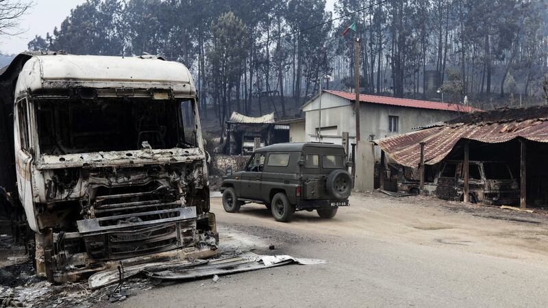 Military personnel arrive at the village of Vila Facaia to help recovery efforts in  the aftermath of the  forest fires, in Pedrógão Grande, Portugal.  Photograph: Paulo Novais/EPA