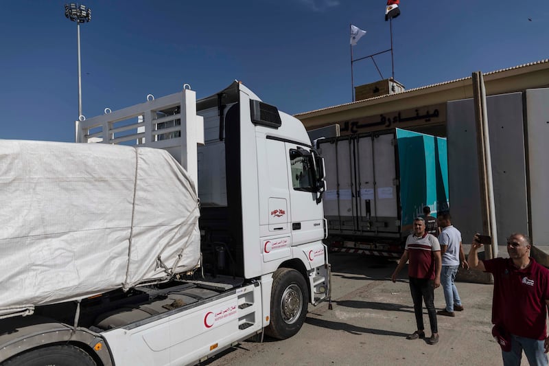 Aid convoy trucks cross the Rafah border into Gaza from the Egyptian side on Saturday.  The aid convoy was organised by a group of Egyptian NGOs. Photograph: Mahmoud Khaled/Getty Images