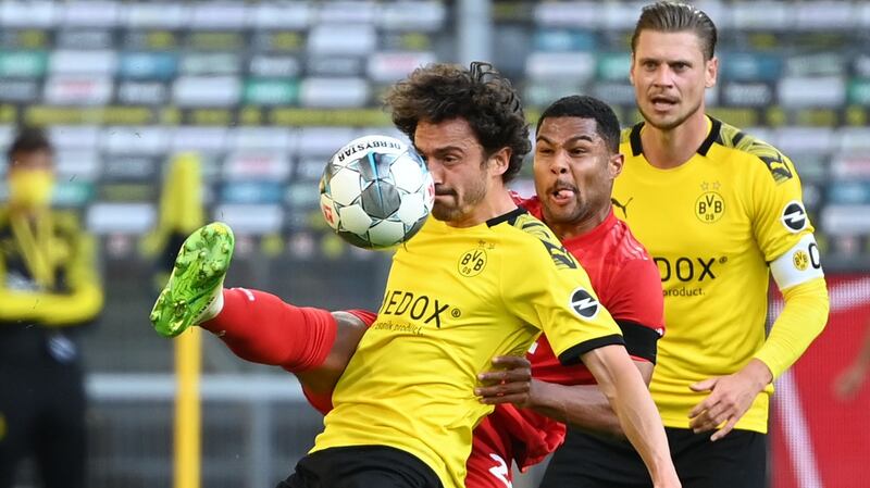 Serge Gnabry challenges Thomas Delaney during Bayern’s narrow win over Dortmund. Photogrph: Federico Gambarini/Getty/AFP