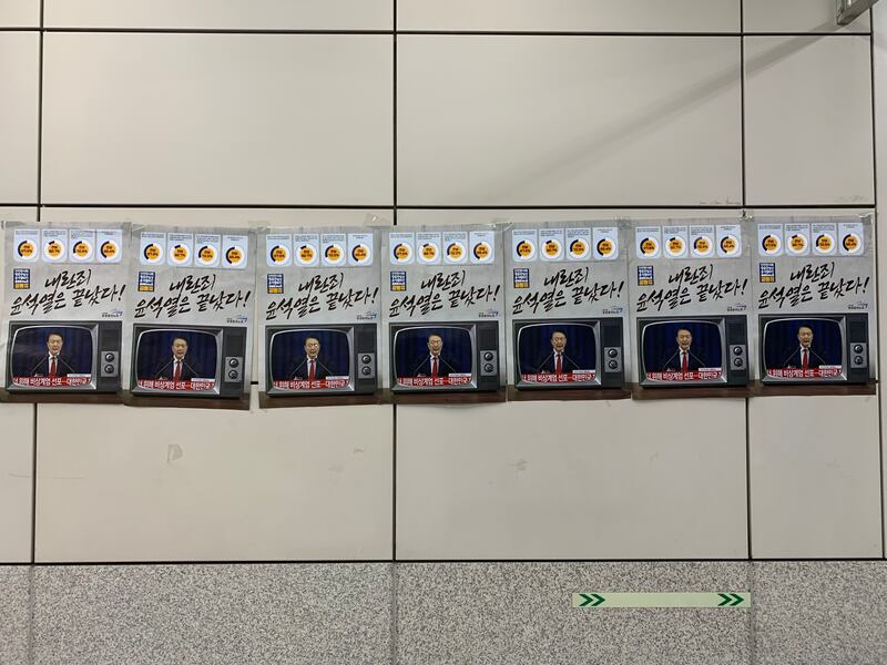 Protest posters on the Seoul underground. Photograph: David McNeill. 