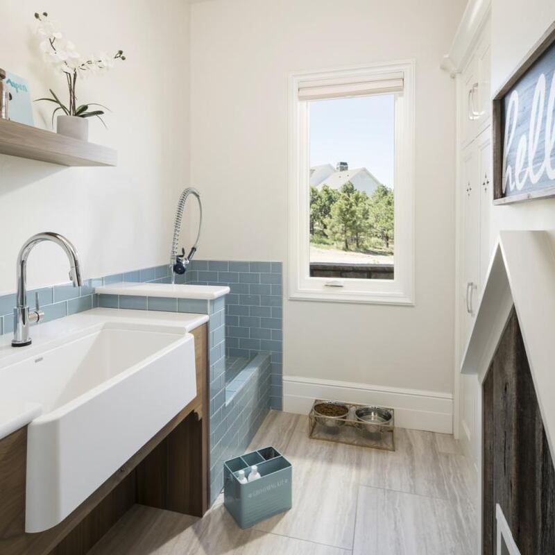 Lost Creek Co: the tiled shower has a low front and a gooseneck showerhead. Photograph: Joshua Caldwell