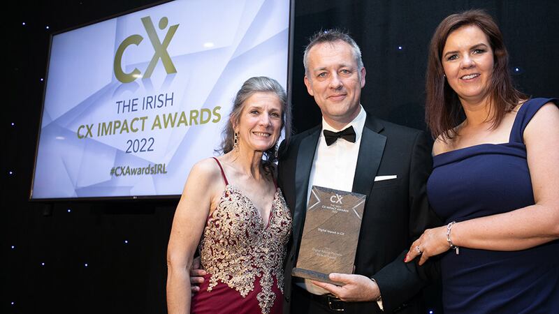 Jan Richards, awards judge, presents the Digital Impact in CX award to Murrough O'Brien and Martha Barry, Bank of Ireland.