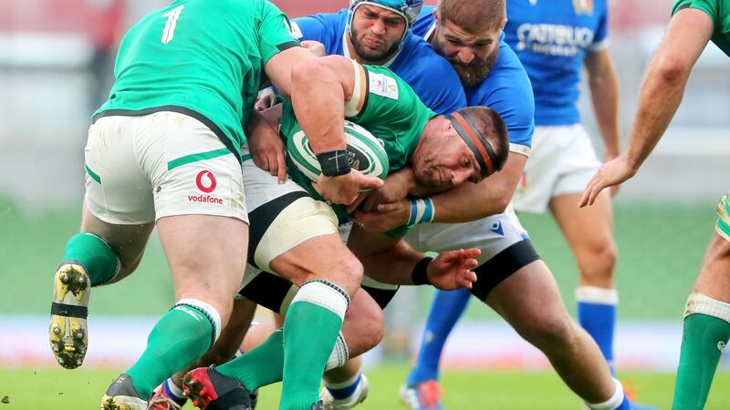 Ireland’s CJ Stander is tackled by Gianmarco Lucchesi and Pietro Ceccarelli of Italy during the Six Nations clash at the Aviva Stadium. Photograph: Bryan Keane/Inpho