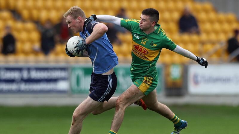 In action for Rhode in the Leinster club quarter final, Ruairi McNamee tackles Brian Conlon of Simonstown. Photograph: Inpho
