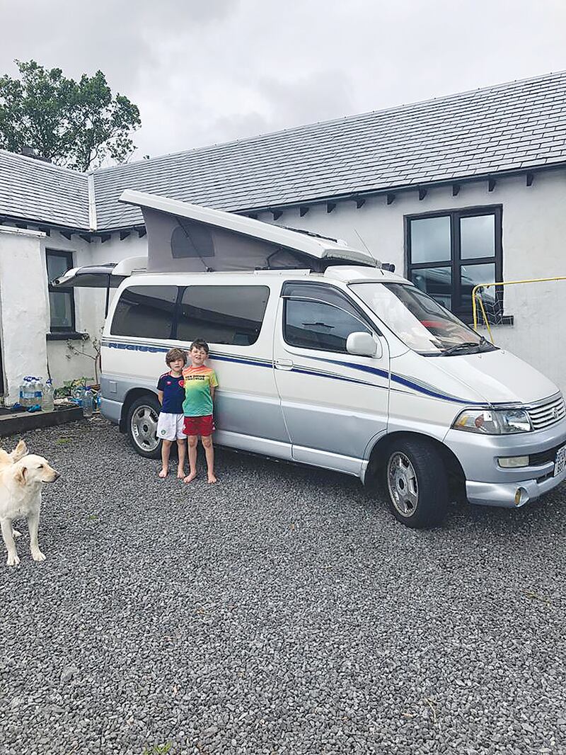 Jonathan Emmans' sons Oisin and Senan with their campervan in Donegal.