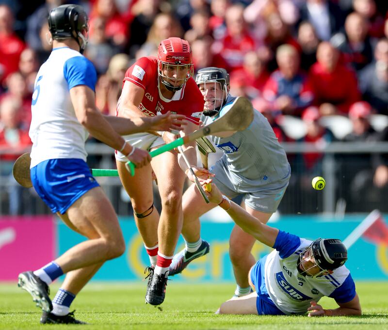 Cork’s Brian Hayes goes past Gavin Fives and goalkeeper Billy Nolan of Waterford to score his side's opening goal on Sunday. Photograph: James Crombie/Inpho