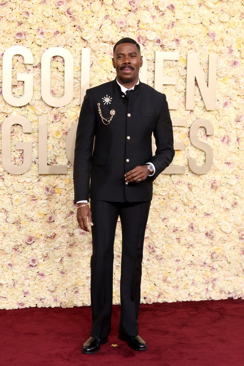 Two statement brooches added some sparkle to Colman Domingo’s slim Louis Vuitton suit. Photograph: Amy Sussman/Getty Images