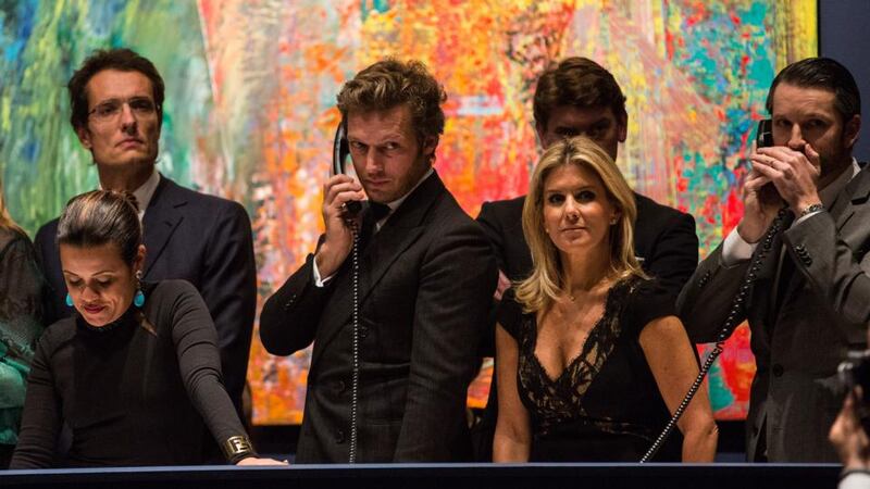 Price points: Sotheby’s taking phone bids on the night last year when an Andy Warhol painting sold for $105 million. Photograph: Andrew Burton/Getty Images